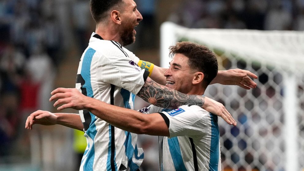 Argentina's Julian Alvarez, right, and Lionel Messi, left, celebrate their side's second goal during the World Cup round of 16 soccer match between Argentina and Australia at the Ahmad Bin Ali Stadium in Doha, Qatar, Saturday, Dec. 3, 2022. (AP Photo