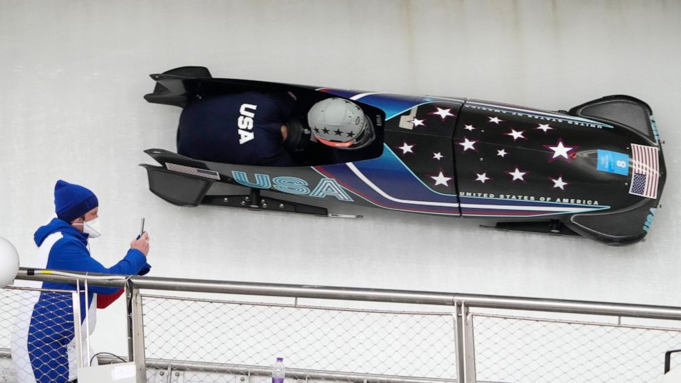 Hunter Church of the United States drives his 2-man bobsled during a training heat at the 2022 Winter Olympics, Friday, Feb. 11, 2022, in the Yanqing district of Beijing. (AP Photo/Dmitri Lovetsky)