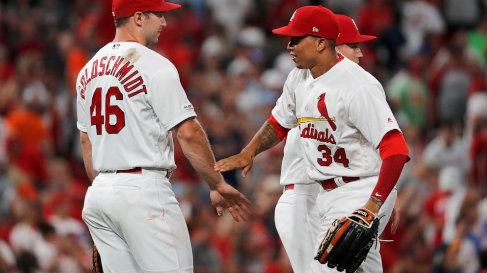 St. Louis Cardinals' Paul Goldschmidt (46) and Yairo Munoz celebrate following a victory over the Houston Astros in a baseball game Friday, July 26, 2019, in St. Louis. (AP Photo/Jeff Roberson)