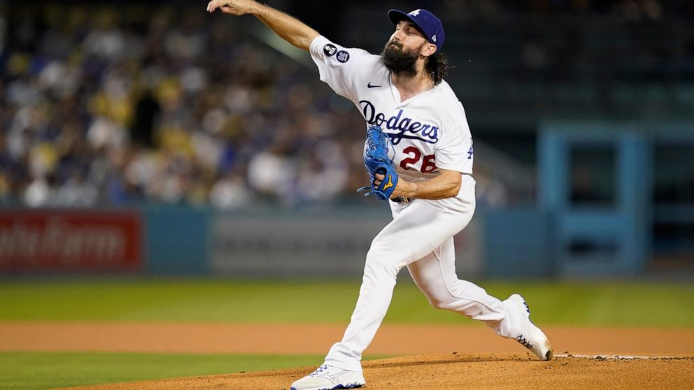 Los Angeles Dodgers starting pitcher Tony Gonsolin (26) throws during the first inning of a baseball game against the Colorado Rockies in Los Angeles, Monday, Oct. 3, 2022. (AP Photo/Ashley Landis)