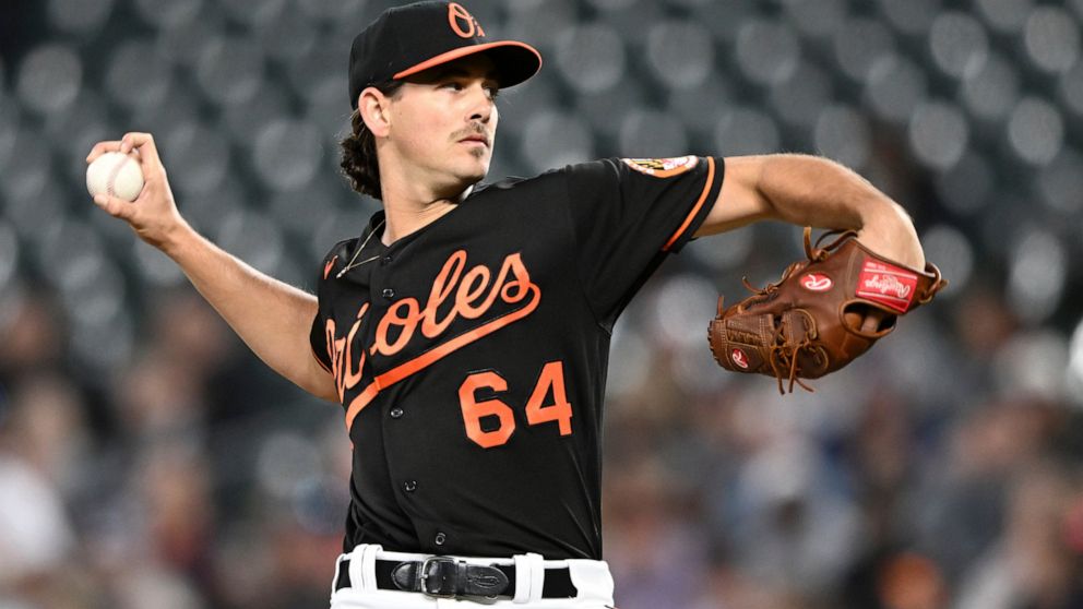 Baltimore Orioles pitcher Dean Kremer delivers to the Houston Astros in the first inning of a baseball game, Friday, Sept. 23, 2022, in Baltimore. (AP Photo/Gail Burton)
