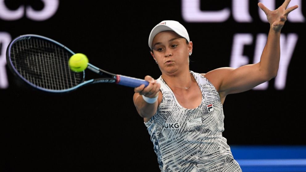 Ash Barty of Australia plays a forehand return to Madison Keys of the U.S. during their semifinal match at the Australian Open tennis championships in Melbourne, Australia, Thursday, Jan. 27, 2022. (AP Photo/Andy Brownbill)