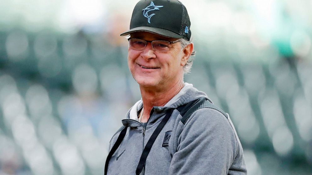 FILE - Then-Miami Marlins manager Don Mattingly smiles after throwing a ball to fans before a baseball game against the Milwaukee Brewers, Saturday, Oct. 1, 2022, in Milwaukee. Mattingly is joining the Toronto Blue Jays as bench coach to manager John