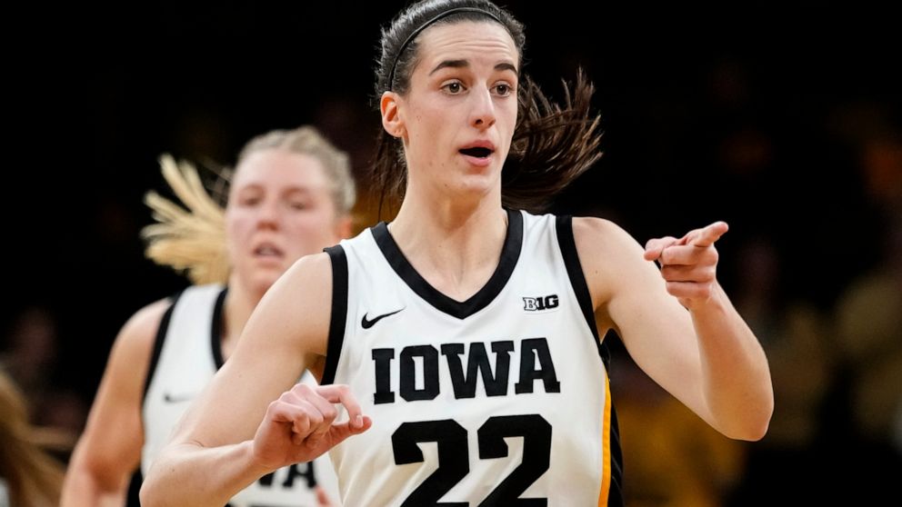 Iowa guard Caitlin Clark reacts after making a basket during the first half of an NCAA college basketball game against North Carolina State, Thursday, Dec. 1, 2022, in Iowa City, Iowa. (AP Photo/Charlie Neibergall)