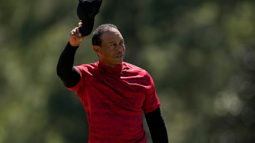 Tiger Woods tips his cap on the 18th green during the final round at the Masters golf tournament on Sunday, April 10, 2022, in Augusta, Ga. (AP Photo/Jae C. Hong)