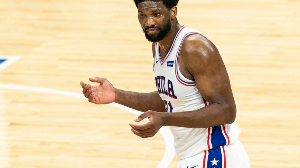 Philadelphia 76ers' Joel Embiid reacts to no call on a shot at the end of the first half of the team's NBA basketball game against the Minnesota Timberwolves, Saturday, April 3, 2021, in Philadelphia. (AP Photo/Chris Szagola)