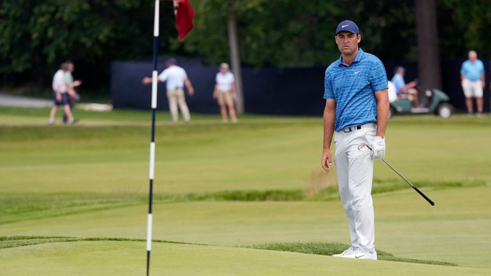 Scottie Scheffler watches his shot on the 15th hole during the second round of the U.S. Open golf tournament at The Country Club, Friday, June 17, 2022, in Brookline, Mass. (AP Photo/Charlie Riedel)