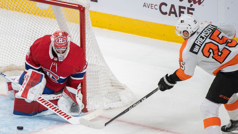 Philadelphia Flyers' James van Riemsdyk shoots on Montreal Canadiens goaltender Carey Price during the third period of an NHL hockey game Thursday, April 21, 2022, in Montreal. (Graham Hughes/The Canadian Press via AP)