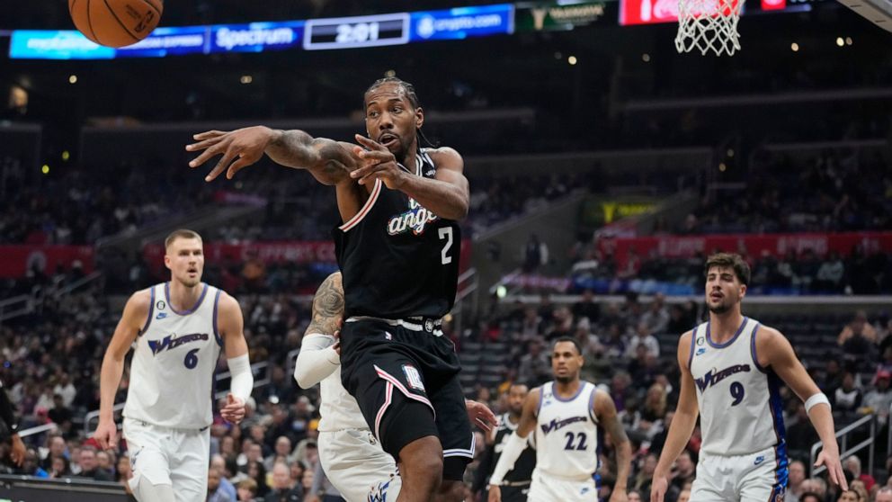 Los Angeles Clippers forward Kawhi Leonard (2) passesthe ball during the first half of an NBA basketball game against the Washington Wizards, Saturday, Dec. 17, 2022, in Los Angeles. (AP Photo/Marcio Jose Sanchez)