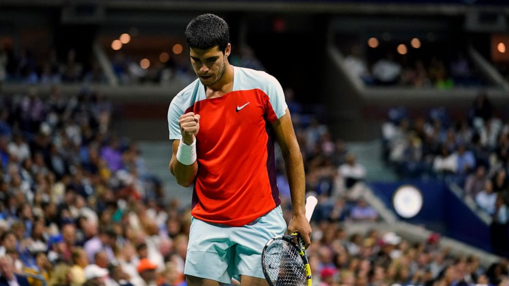 Carlos Alcaraz, of Spain, reacts after scoring a point against Frances Tiafoe, of the United States, during the semifinals of the U.S. Open tennis championships, Friday, Sept. 9, 2022, in New York. (AP Photo/Matt Rourke)
