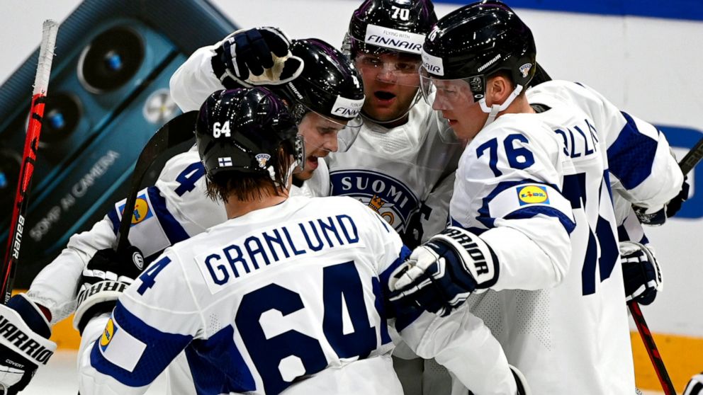 Team of Finland celebrate a goal during the 2022 IIHF Ice Hockey World Championships preliminary round group B match between Latvia and Finland in Tampere, Finland, Saturday, May 14, 2022. (Emmi Korhonen/Lehtikuva via AP)