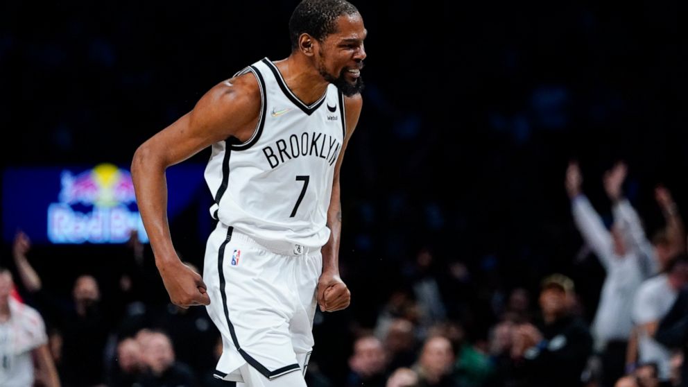 Brooklyn Nets' Kevin Durant (7) celebrates after making a 3-point basket during the second half of an NBA basketball game against the Utah Jazz, Monday, March 21, 2022, in New York. (AP Photo/Frank Franklin II)