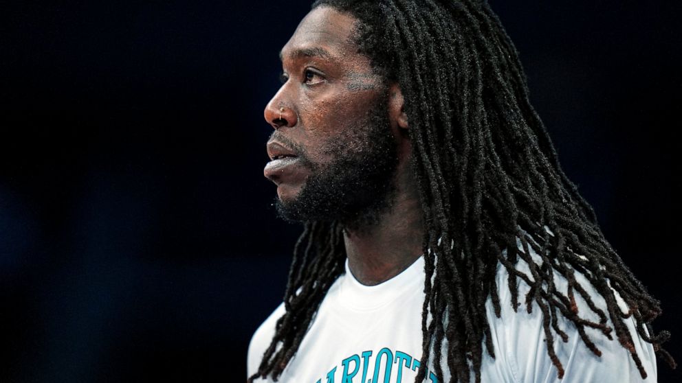 FILE - Charlotte Hornets center Montrezl Harrell (8) warms up prior to an NBA basketball game against the Dallas Mavericks on Saturday, March 19, 2022, in Charlotte, N.C. Harrell is facing a felony drug charge after authorities said they found vacuum