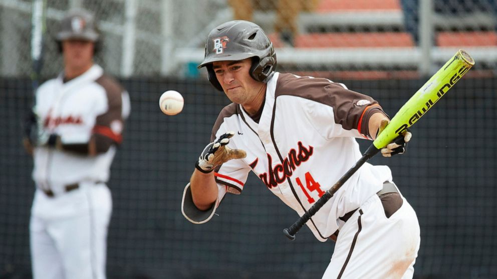 FILE - In this May 10, 2019, file photo, Bowling Green's Neil Lambert bats during the team's NCAA college baseball game against Kent Sate in Bowling Green, Ohio. Bowling Green recently announced that it is dropping baseball. Colleges mulling whether 
