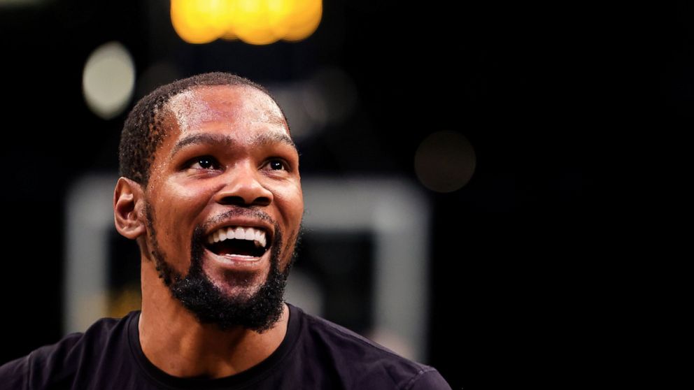 Brooklyn Nets forward Kevin Durant (7) smiles before the start of an NBA basketball game against the Oklahoma City Thunder, Thursday, Jan. 13, 2022, in New York. (AP Photo/Jessie Alcheh)