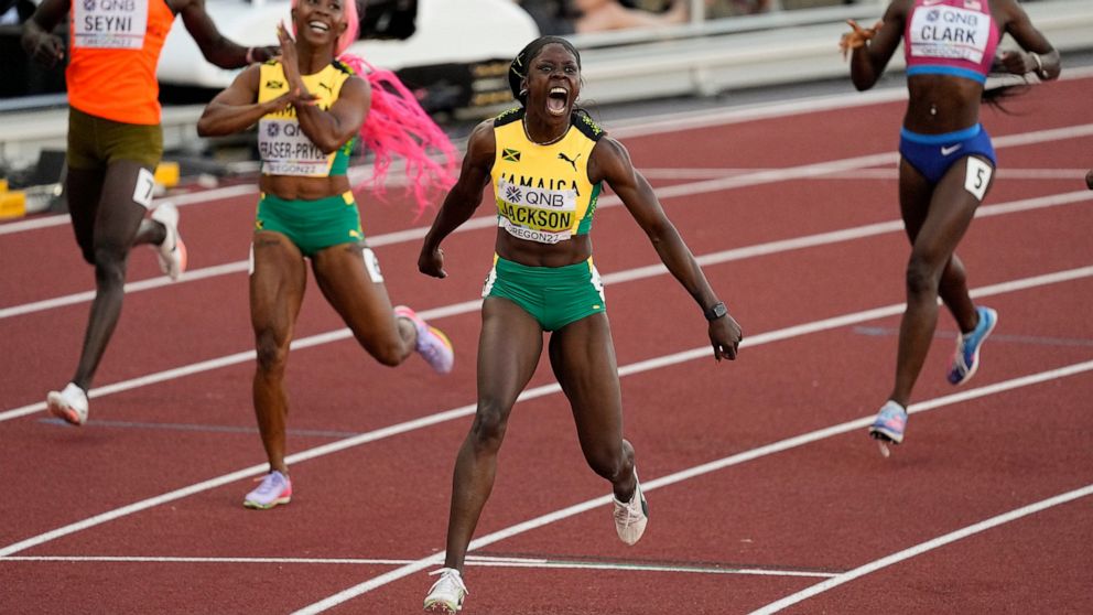 Shericka Jackson, of Jamaica, wins the final of the women's 200-meter run ahead of Shelly-Ann Fraser-Pryce, of Jamaica, at the World Athletics Championships on Thursday, July 21, 2022, in Eugene, Ore. (AP Photo/Gregory Bull)