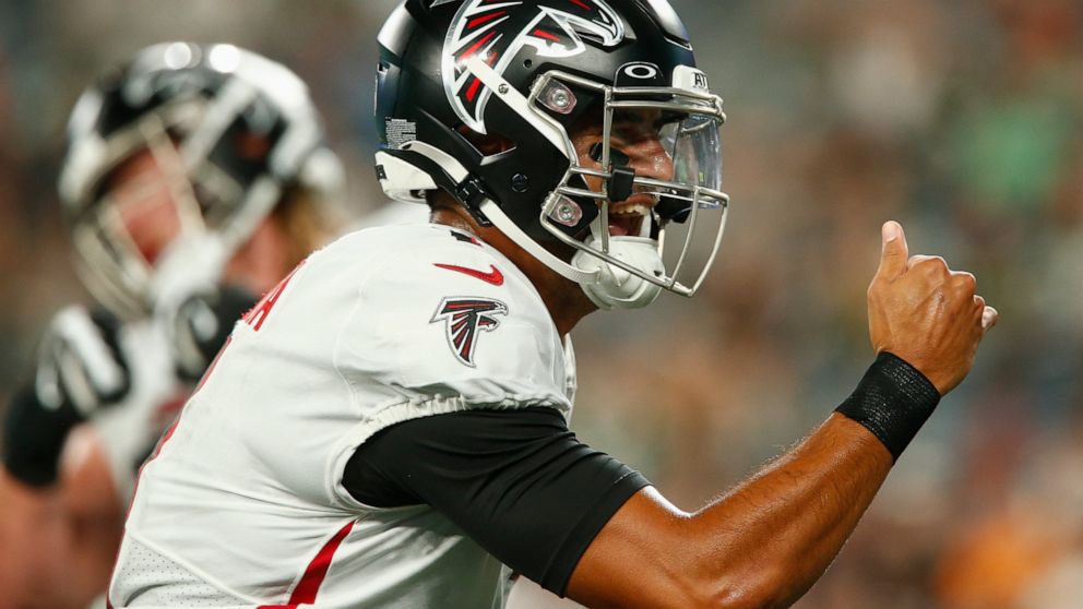 Atlanta Falcons quarterback Marcus Mariota (1) celebrates after wide receiver Olamide Zaccheaus (17) scores a touchdown during the first half of an NFL football game against the New York Jets, Monday, Aug. 22, 2022, in East Rutherford, N.J. (AP Photo