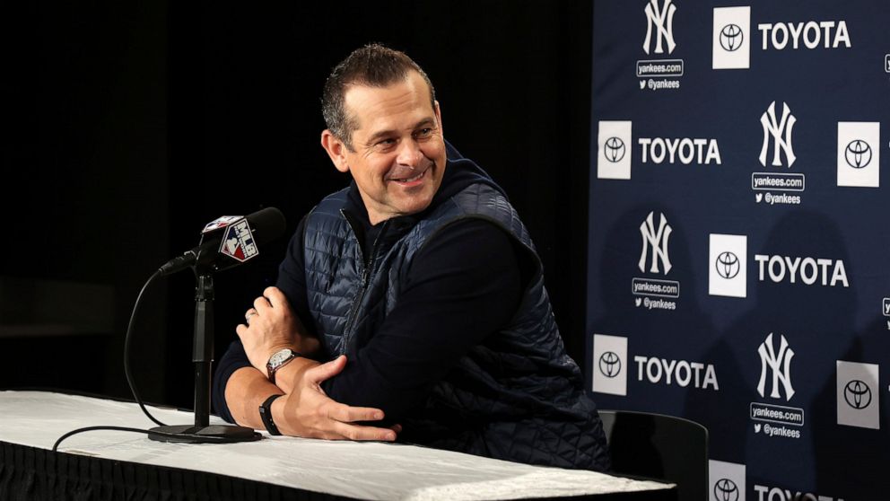 New York Yankees manager Aaron Boone laughs before answering a question during a news conference at the American League Wild Card Workout Day at Fenway Park, Monday, Oct. 4, 2021, before Tuesday's American League Wild Card game against the Boston Red