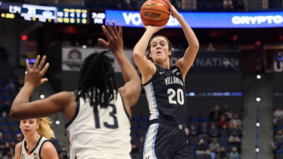 Villanova's Maddy Siegrist (20) shoots over Connecticut's Christyn Williams (13) in the first half of an NCAA college basketball game, Wednesday, Feb. 9, 2022, in Hartford, Conn. (AP Photo/Jessica Hill)