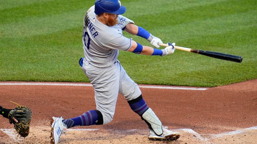 Los Angeles Dodgers' Justin Turner doubles off Pittsburgh Pirates starting pitcher Bryse Wilson, driving in two runs, during the third inning of a baseball game in Pittsburgh, Tuesday, May 10, 2022. (AP Photo/Gene J. Puskar)