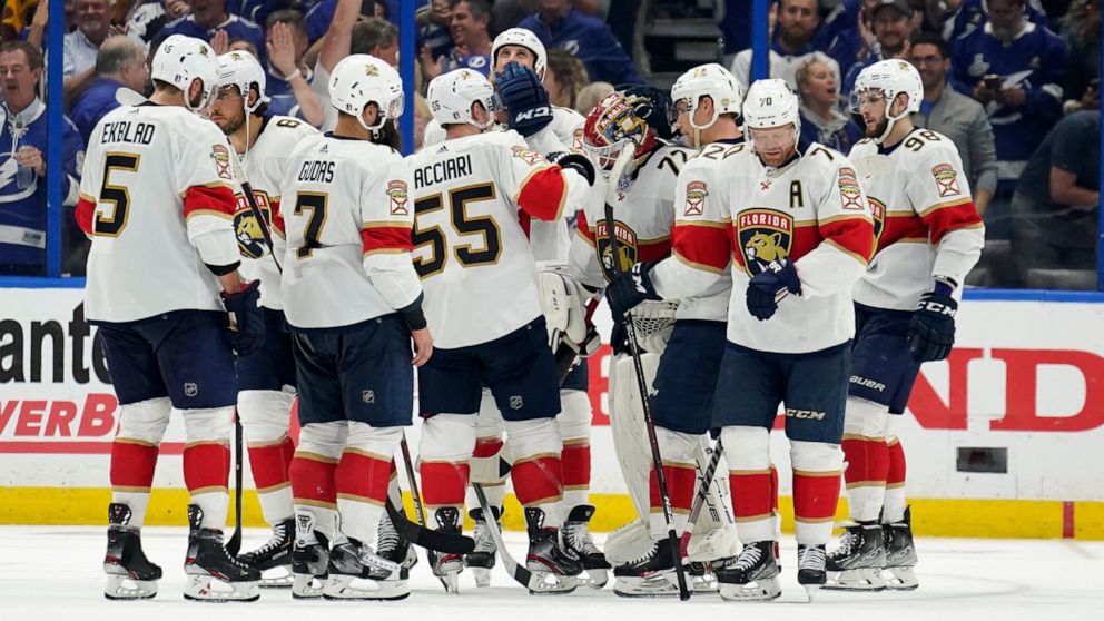 Florida Panthers players consol goaltender Sergei Bobrovsky (72) after the Tampa Bay Lightning eliminated the Panthers during Game 4 of an NHL hockey second-round playoff series Monday, May 23, 2022, in Tampa, Fla. (AP Photo/Chris O'Meara)