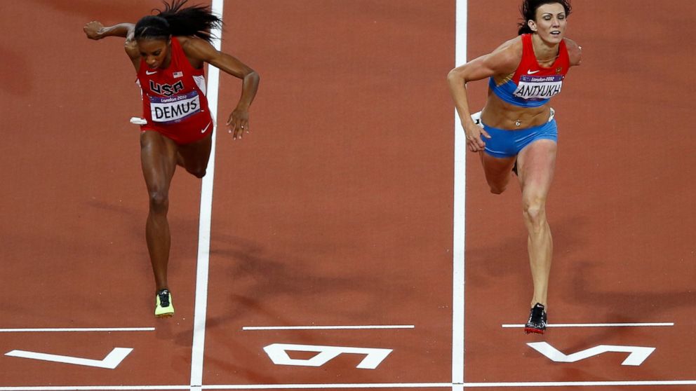 FILE - Russia's Natalya Antyukh, right, powers ahead of United States' Lashinda Demus to win gold in the women's 400-meter hurdles final during the athletics in the Olympic Stadium at the 2012 Summer Olympics in London, Wednesday, Aug. 8, 2012. Russi