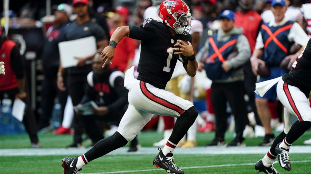 Atlanta Falcons quarterback Marcus Mariota (1) runs against the San Francisco 49ers during the second half of an NFL football game, Sunday, Oct. 16, 2022, in Atlanta. (AP Photo/John Bazemore)