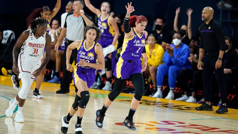 Los Angeles Sparks center Amanda Zahui B (1) signals after making a three-point basket during the first half of a WNBA basketball game against the Washington Mystics Thursday, June 24, 2021, in Los Angeles.(AP Photo/Marcio Jose Sanchez)