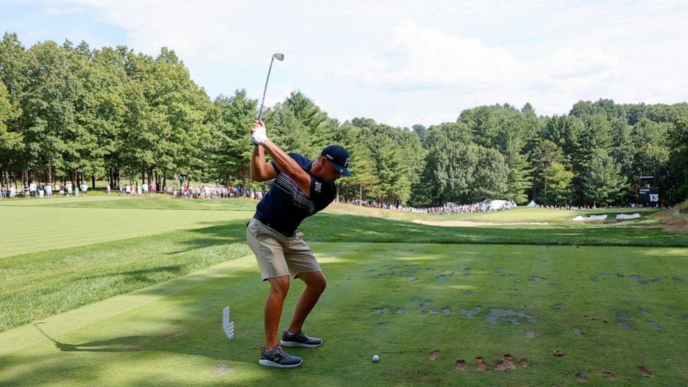Bryson DeChambeau tees off on the 13th during the final round of the LIV Golf Invitational-Boston tournament, Sunday, Sept. 4, 2022, in Bolton, Mass. (AP Photo/Mary Schwalm)