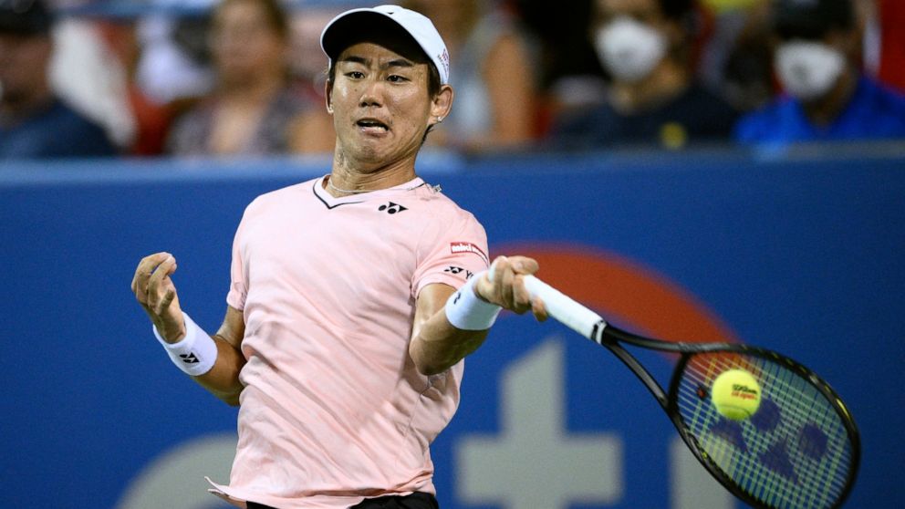 Yoshihito Nishioka, of Japan, hits a return to Andrey Rublev, of Russia, during a semifinal at the Citi Open tennis tournament Saturday, Aug. 6, 2022, in Washington. (AP Photo/Nick Wass)