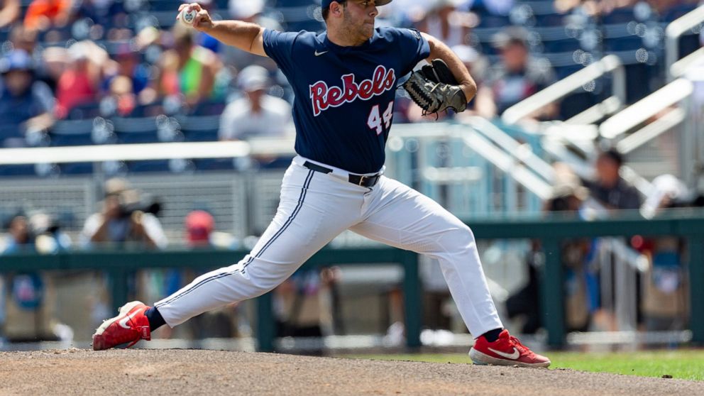 Mississippi staring pitcher Dylan DeLucia (44) throws a pitch in the first inning against Arkansas during an NCAA College World Series baseball game Thursday, June 23, 2022, in Omaha, Neb. (AP Photo/John Peterson)