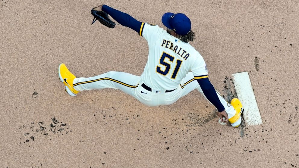 Milwaukee Brewers starting pitcher Freddy Peralta throws during the first inning of a baseball game against the Atlanta Braves Monday, May 16, 2022, in Milwaukee. (AP Photo/Morry Gash)