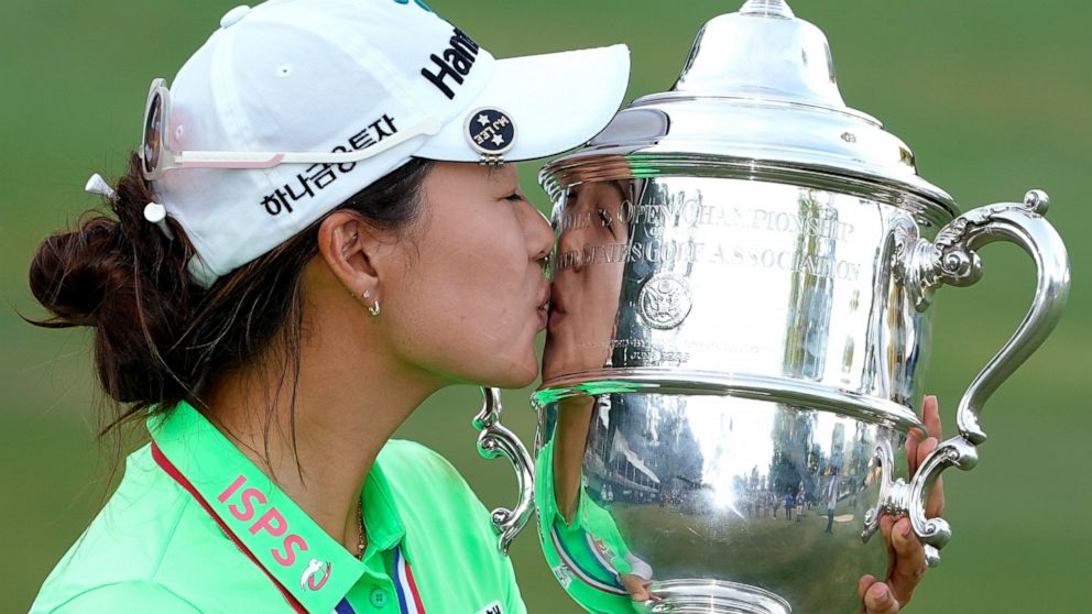 Minjee Lee, of Australia, kisses the Harton S. Semple Trophy after Lee won the final round of the U.S. Women's Open golf tournament at the Pine Needles Lodge & Golf Club in Southern Pines, N.C., on Sunday, June 5, 2022. Minjee Lee, of Australia, won 