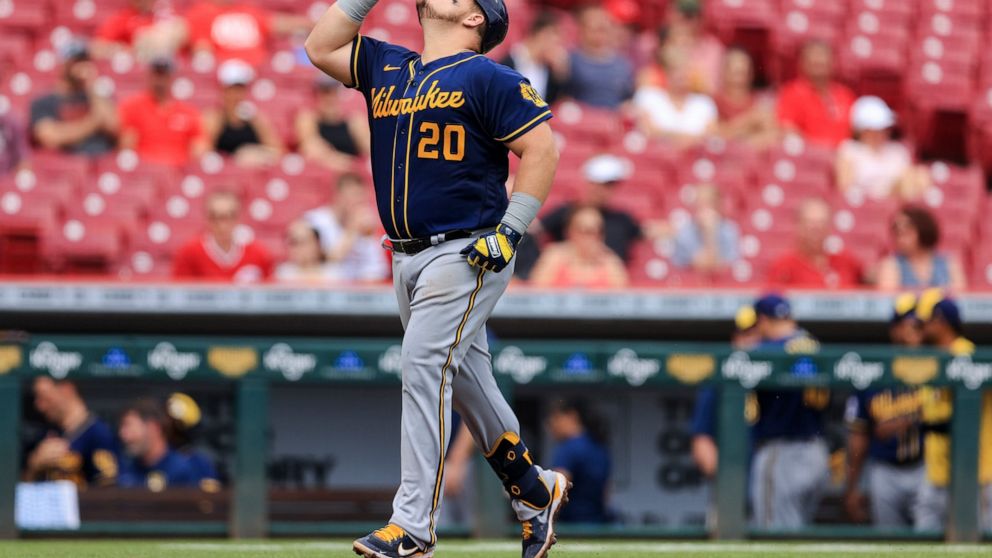Milwaukee Brewers' Daniel Vogelbach reacts as he runs the bases after hitting a two-run home run during the seventh inning of a baseball game against the Cincinnati Reds in Cincinnati, Thursday, June 10, 2021. (AP Photo/Aaron Doster)