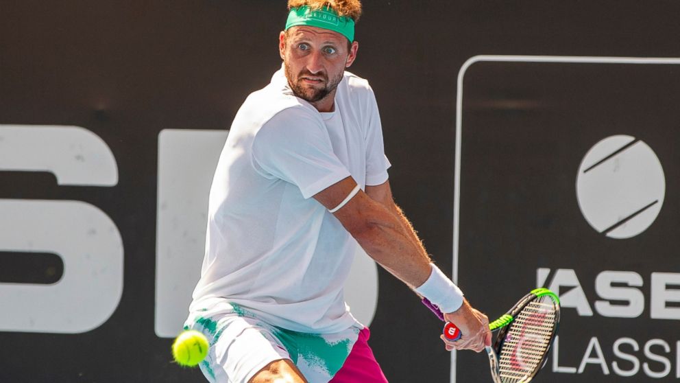 Tennys Sandgren of the U.S. plays a shot against Britain's Cameron Norrie during their singles final match in the ASB Classic at ASB Tennis Arena in Auckland, New Zealand, Saturday, Jan. 12, 2019. (AP Photo/David Rowland)