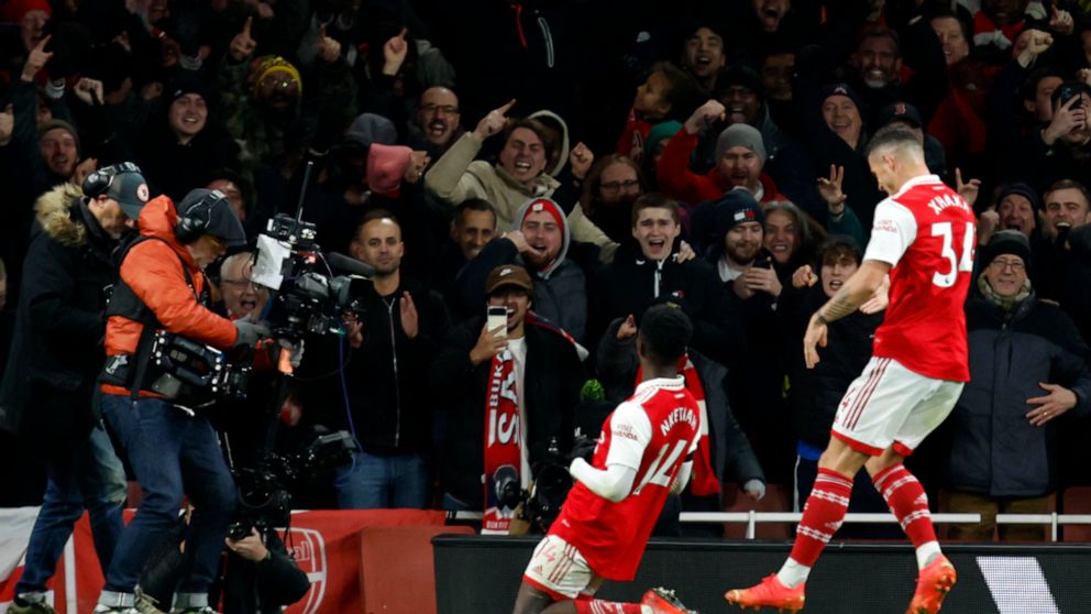 Arsenal's Eddie Nketiah, center, celebrates after scoring his side's third goal during the English Premier League soccer match between Arsenal and West Ham United at Emirates stadium in London, Monday, Dec. 26, 2022. (AP Photo/David Cliff)