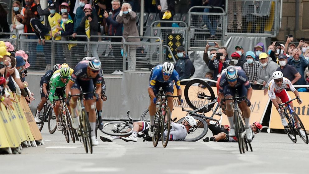 Slovakia's Peter Sagan, left, crashes with Australia's Caleb Ewan, right, during the sprint towards the finish line of the third stage of the Tour de France cycling race over 182.9 kilometers (113.65 miles) with start in Lorient and finish in Pontivy