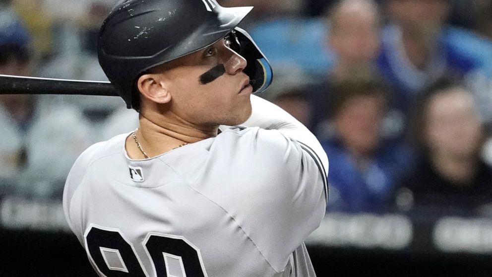 New York Yankees' Aaron Judge watches his three-run home run during the seventh inning of a baseball game against the Kansas City Royals Friday, April 29, 2022, in Kansas City, Mo. (AP Photo/Charlie Riedel)