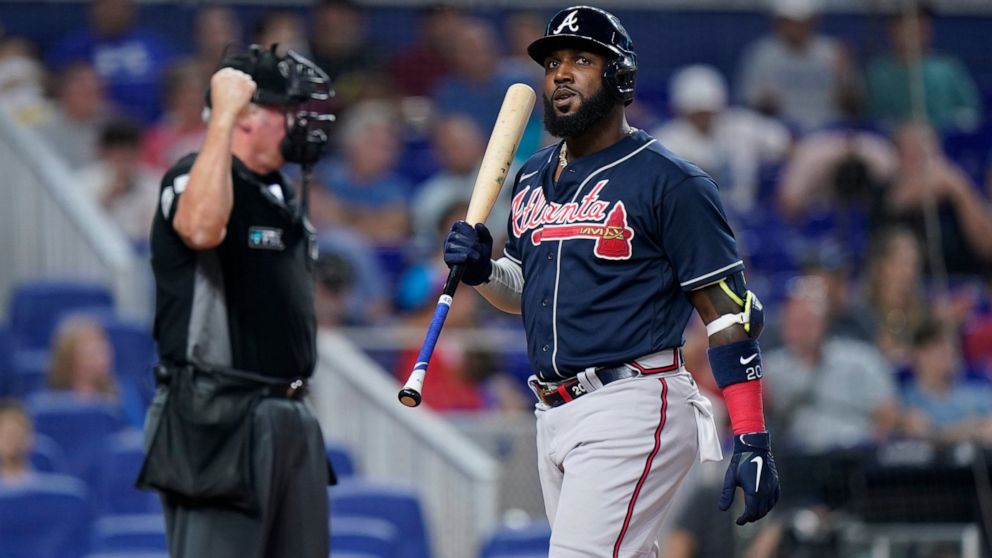 Atlanta Braves' Marcell Ozuna reacts after striking out during the seventh inning of a baseball game against the Miami Marlins, Sunday, Aug. 14, 2022, in Miami. (AP Photo/Wilfredo Lee)