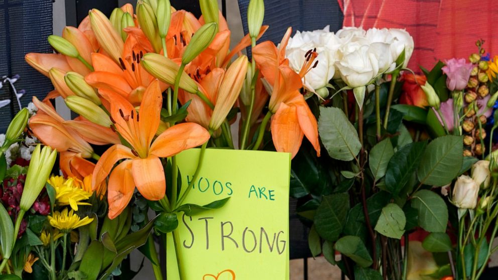 Memorial flowers and notes line walkway at Scott Stadium after three football players were killed in a shooting on the grounds of the University of Virginia Tuesday Nov. 15, 2022, in Charlottesville. Va. Authorities say three people have been killed 