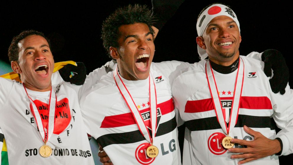 FILE - Brazil's Sao Paulo midfielder Richarlyson, center, celebrate with teammates their gold medals after winning the FIFA Club World Championship Toyota Cup title in Yokohama, near Tokyo, Dec. 18, 2005. The former Brazil and Sao Paulo midfielder sa