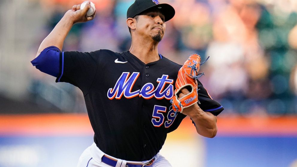 New York Mets' Carlos Carrasco pitches during the first inning of a baseball game against the Miami Marlins, Friday, June 17, 2022, in New York. (AP Photo/Frank Franklin II)