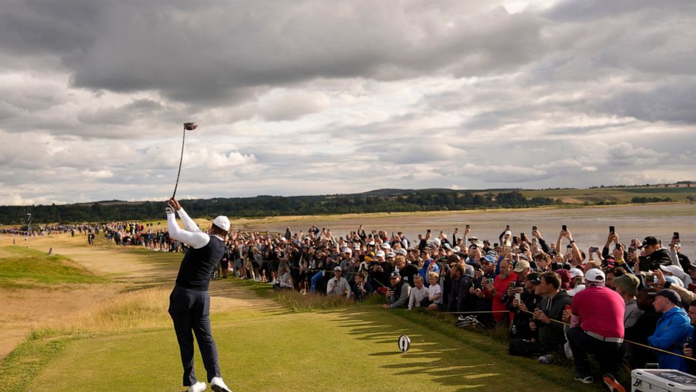 Tiger Woods of the US plays from the 12th tee during the first round of the British Open golf championship on the Old Course at St. Andrews, Scotland, Thursday, July 14, 2022. The Open Championship returns to the home of golf on July 14-17, 2022, to 