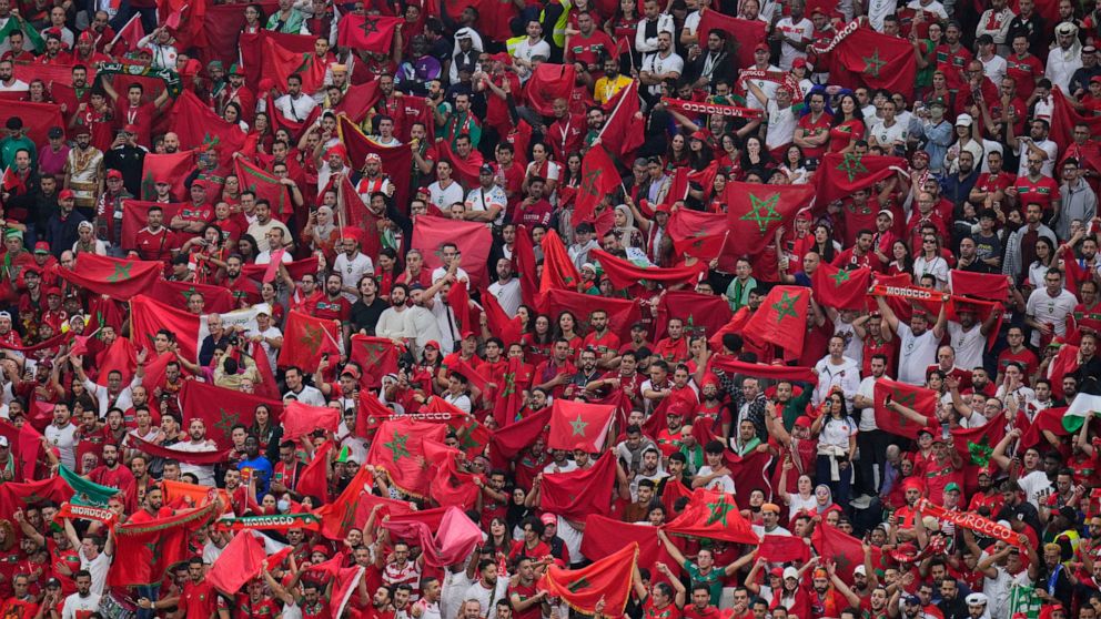 Moroccan fans cheer during the World Cup semifinal soccer match between France and Morocco at the Al Bayt Stadium in Al Khor, Qatar, Wednesday, Dec. 14, 2022. (AP Photo/Hassan Ammar)