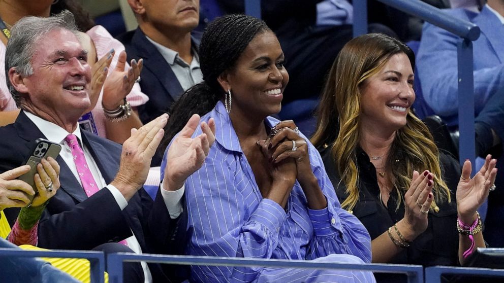 Michelle Obama, second from right, reacts while watching the semifinal match between Frances Tiafoe, of the United States, and Carlos Alcaraz, of Spain, with Jill McCormick, right, at the U.S. Open tennis championships, Friday, Sept. 9, 2022, in New 