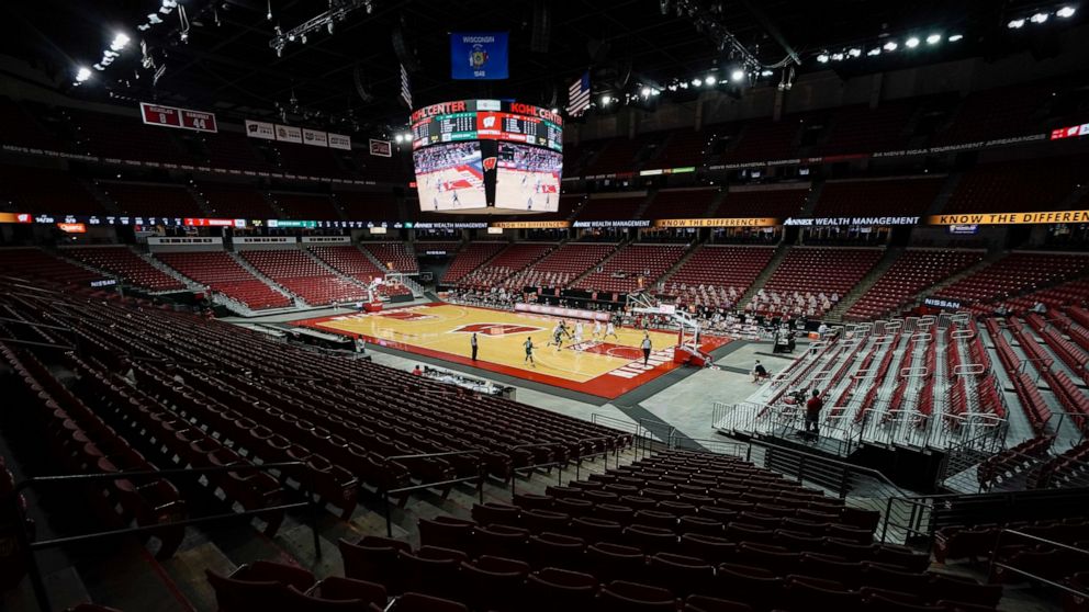 The seats at the Kohl Center are empty during the first half of an NCAA college basketball game between Wisconsin and Wisconsin-Green Bay Tuesday, Dec. 1, 2020, in Madison, Wis. (AP Photo/Morry Gash)