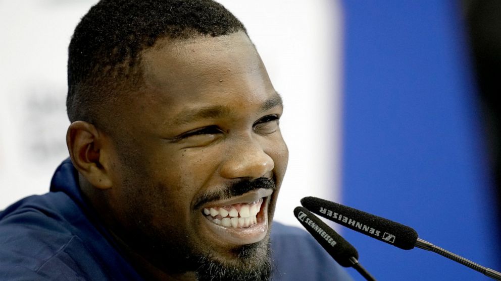France's Marcus Thuram laughs during a press conference at the Jassim Bin Hamad stadium in Doha, Qatar, Thursday, Nov. 24, 2022. France will play in the World Cup against Denmark on Nov. 26. (AP Photo/Christophe Ena)