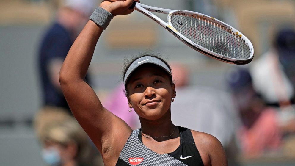 FILE - Japan's Naomi Osaka celebrates after defeating Romania's Patricia Maria Tig during a first-round match of the French Open tennis tournament at Roland Garros stadium in Paris, May 30, 2021. Naomi Osaka pulled out of Wimbledon on Saturday June 1