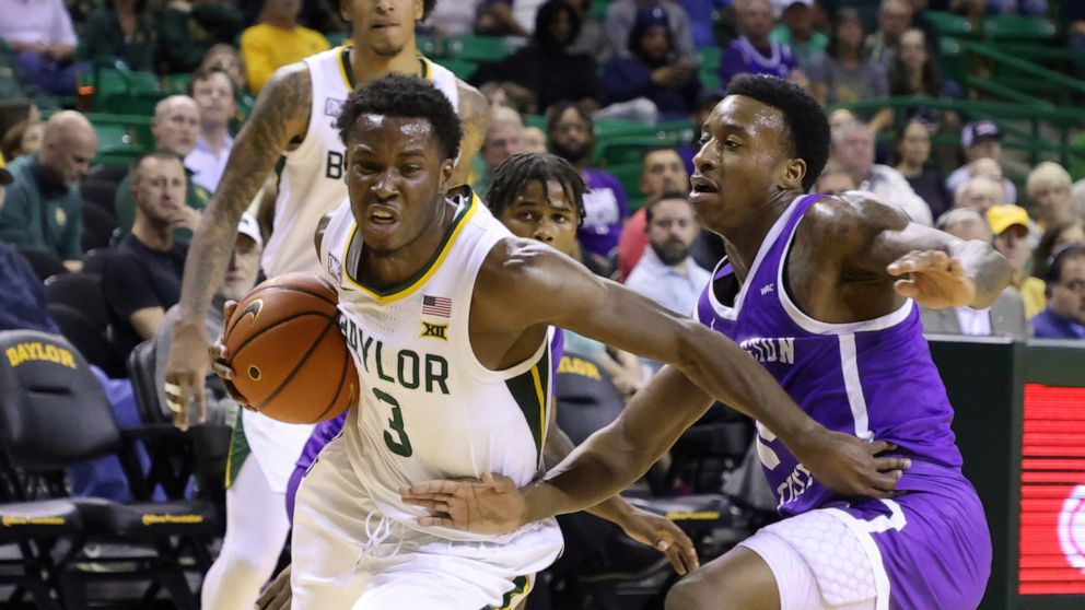 Baylor guard Dale Bonner (3) drives past Tarleton State guard Javontae Hopkins in the first half of an NCAA college basketball game, Tuesday, Dec. 6, 2022, in Waco, Texas. (AP Photo/Rod Aydelotte)