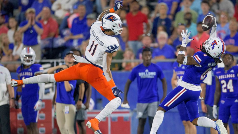 UTSA wide receiver Tykee Ogle-Kellogg (11) tries to grab a catch that was almost intercepted by Louisiana Tech defensive back Baylen Buchanan (0) in the first half of an NCAA college football game in Ruston, La., Saturday, Oct. 23, 2021. (AP Photo/Ma